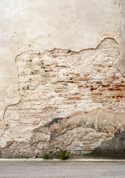 abandoned grunge cracked brick stucco wall