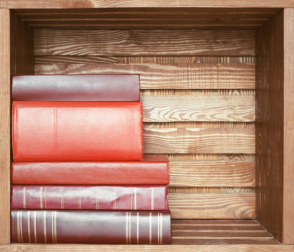 Books on wooden shelf — Stock Photo, Image