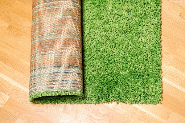 Rolled carpet on the floor — Stock Photo, Image