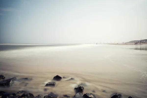 Minimalist misty seascape with rocks — Stock Photo, Image