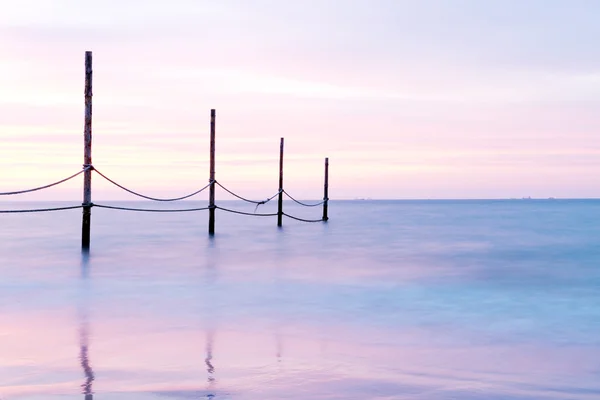 Beautiful rose sunset at a coast — Stock Photo, Image