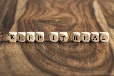 Word KEEP IT REAL on wooden cubes clipart