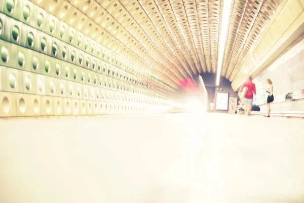 Train station and train in motion blur, toned image. — Stock Photo, Image