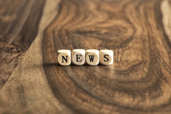 Word NEWS on wooden cubes — Stock Photo, Image