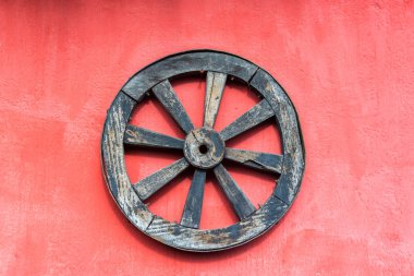 Old Wagon Wheel and Red Wall clipart