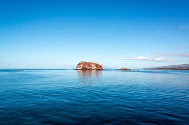 Blue Sea and Small Island clipart