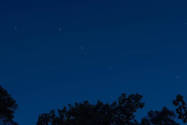 Beautiful view of defocus of falling stars in the night sky.