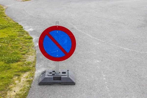 Close up view of temporary traffic sign on asphalt road. Sweden.