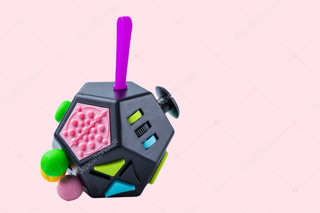 Beautiful view of colorful anti stress toy isolation on pink background. Health concept. Sweden.