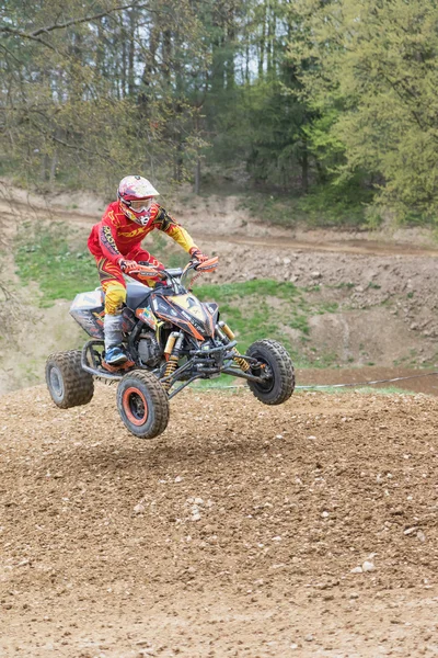 Quad rider before impact after the jump — Stock Photo, Image