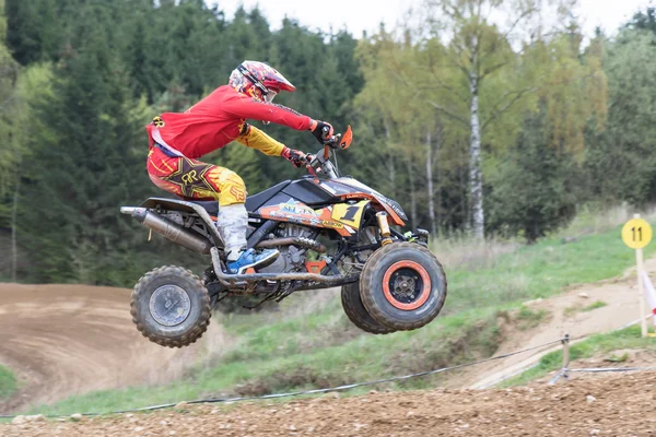 Closeup dynamic shot of quad rider jumping — Stock Photo, Image