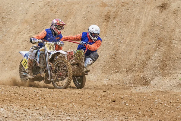 Pair of sidecar racers in dirty terrain — Stock Photo, Image