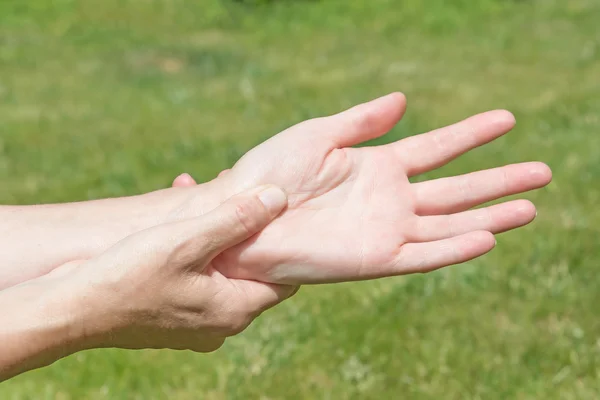 Woman showing hands pain — Stock Photo, Image