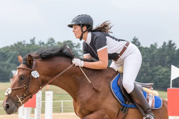 Closeup view of horsewoman jumping — Stock Photo, Image