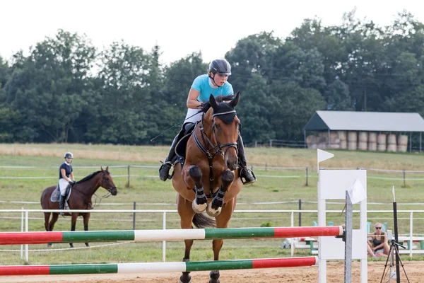 Horsewoman during the jump-off — Stock Photo, Image