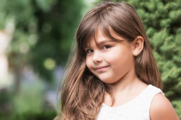 Portrait of smiling attractive little girl — Stock Photo, Image