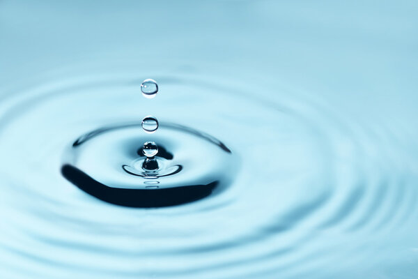 Water drop falling abstract