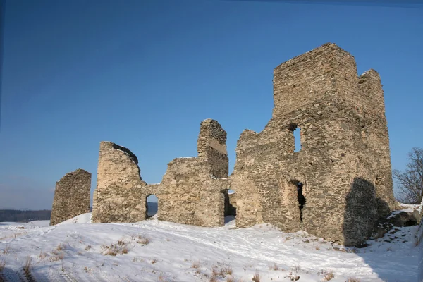 Ruins of the ancient castle in winter. — Stock Photo, Image