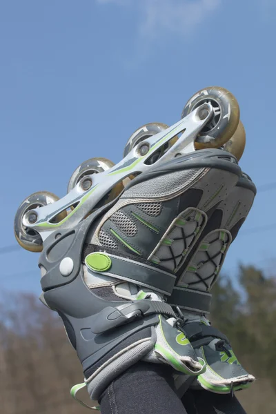 Rollerblades against a blue sky — Stock Photo, Image