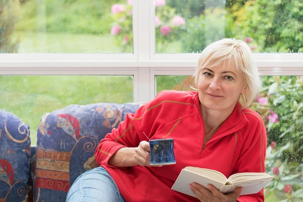 Blonde middle-aged woman is relaxing — Stock Photo, Image