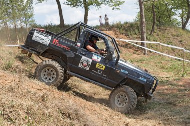  Black off road car in difficult terrain