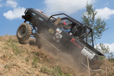  Black off road car is on the top of the steep hill