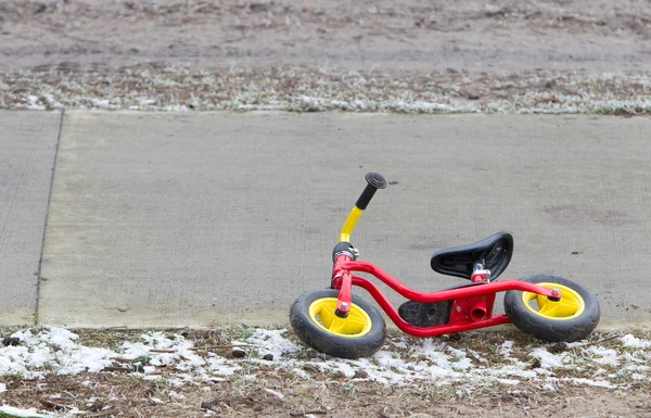 Red childrens balance bicycle — Stock Photo, Image