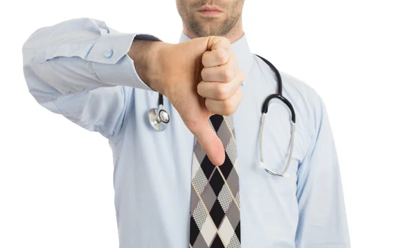 Caucasian male doctor making a dislike gesture — Stock Photo, Image