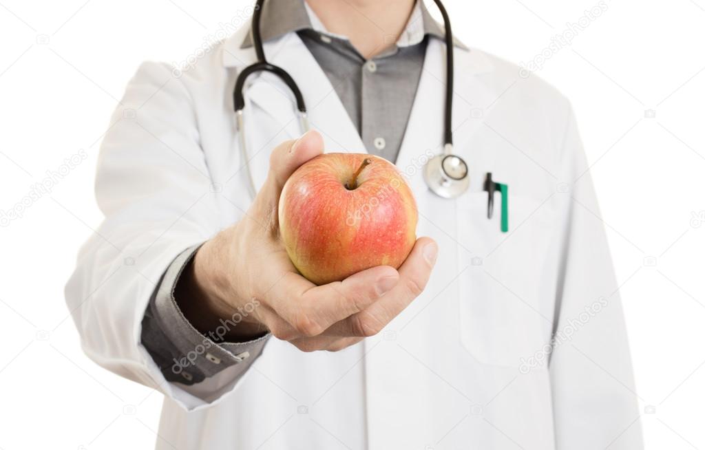 Nutritionist doctor, giving an apple, isolated