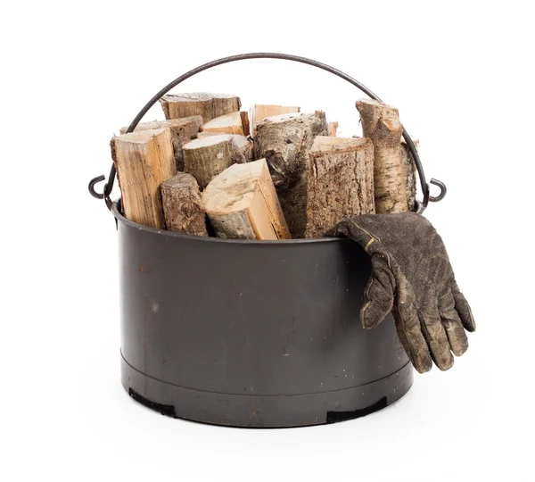 Metal basket of firewood — Stock Photo, Image