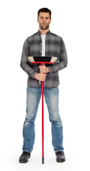 Young worker with a broom — Stock Photo, Image