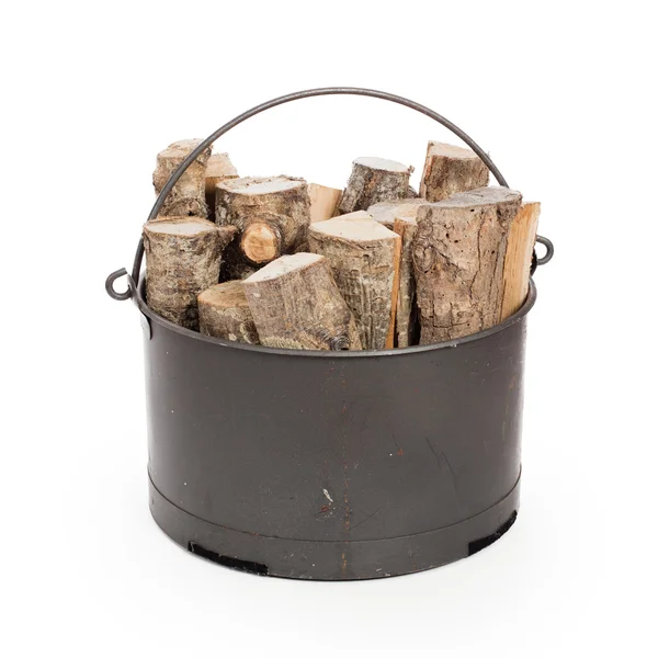 Metal basket of firewood — Stock Photo, Image