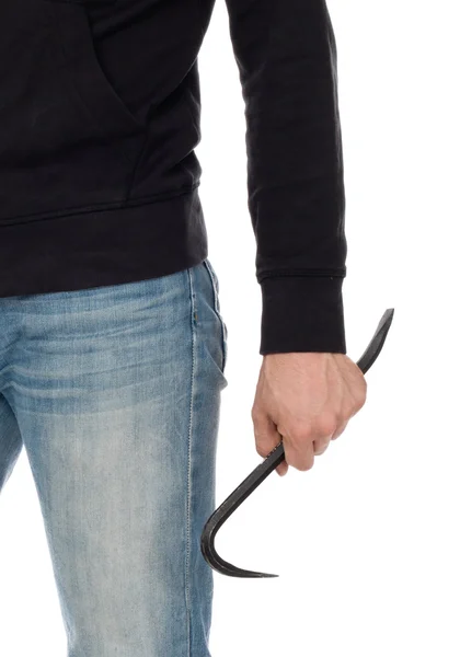 Crime concept. Criminal in hood with crowbar in hand — Stock Photo, Image