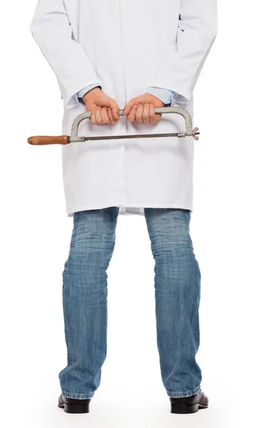 Crazy doctor is holding a big saw in his hands — Stock Photo, Image