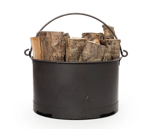 Metal basket of firewood — Stock Photo, Image