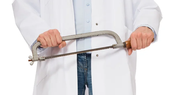 Crazy doctor is holding a big saw in his hands — Stock Photo, Image