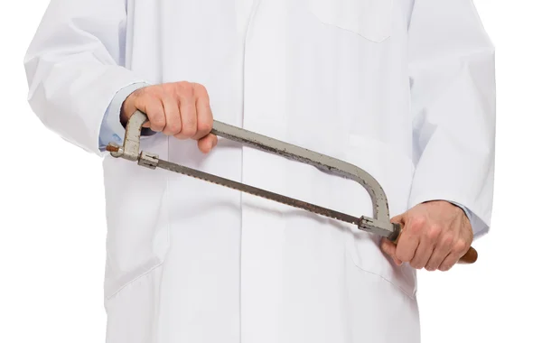Crazy doctor is holding a big saw in his hands — Stock Photo, Image