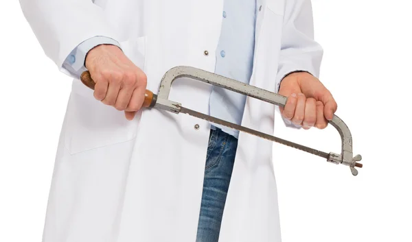 Crazy doctor is holding a big saw in his hands — Stock Photo, Image