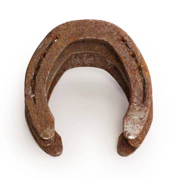 Stack of old rusty horseshoes — Stock Photo, Image