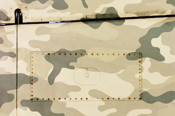 Bit av flygplan grunge metall bakgrund, armén camo — Stockfoto