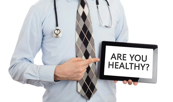 Médico segurando tablet - Você é saudável ? — Fotografia de Stock