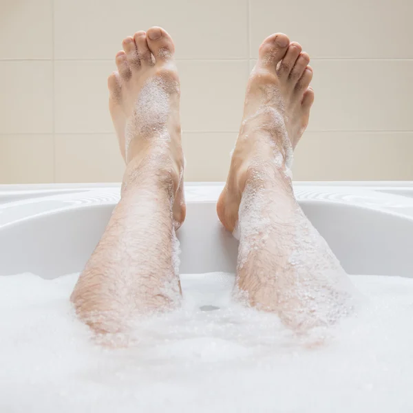 Photos mens feet Men's feet in a bathtub, selective focus on toes