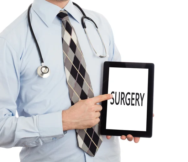 Lekarz trzymając tabletkę - Chirurgia — Zdjęcie stockowe