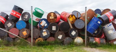 AKRANES, ICELAND - AUGUST 1, 2016: Oil barrels or chemical drums clipart