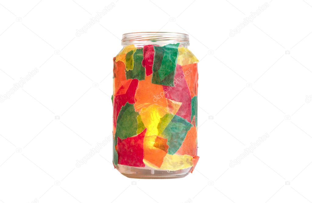 Jar decorated with colorful paper, tealight, isolated, candle burning inside