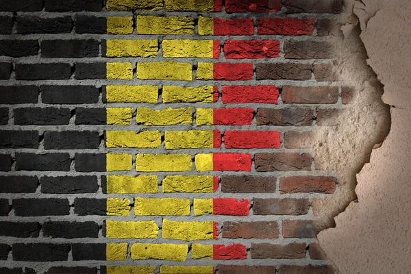 Donkere bakstenen muur met gips - België — Stockfoto