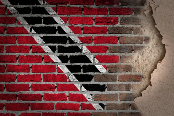 Donkere bakstenen muur met gips - trinidad en tobago — Stockfoto