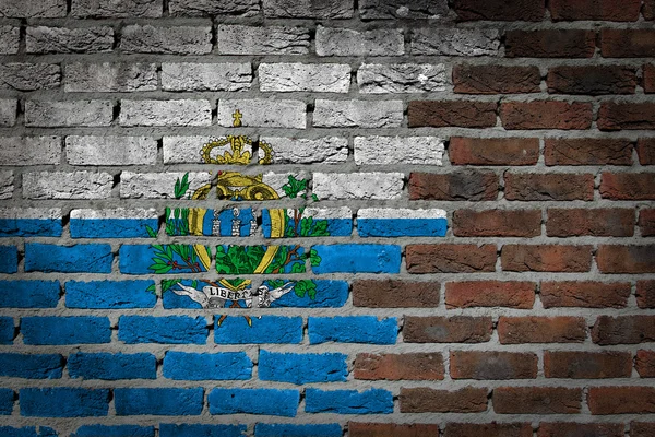 Textura de pared de ladrillo con bandera —  Fotos de Stock