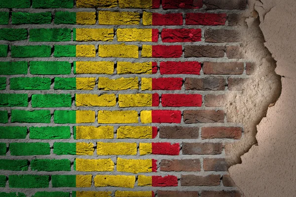 Dunkle Ziegelwand mit Putz - mali — Stockfoto