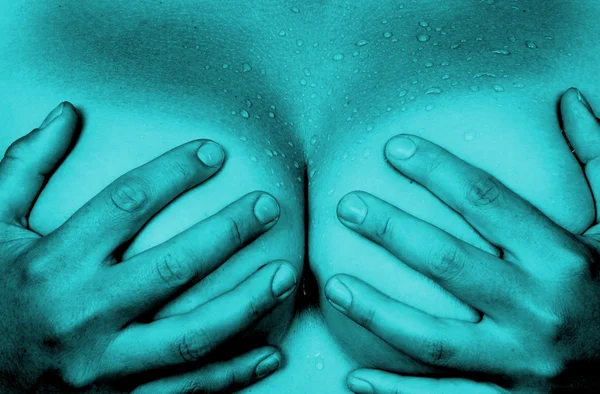 Hands covering breasts — Stock Photo, Image